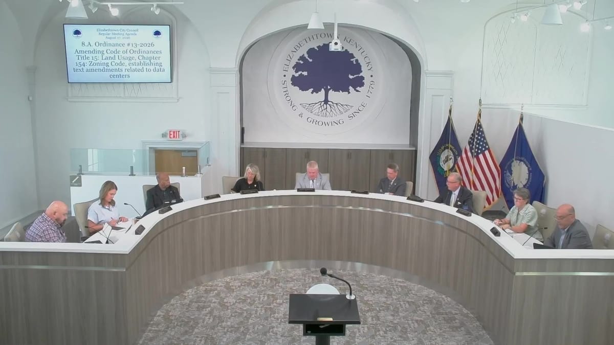 The Elizabethtown City Council at the dais during the second reading of data center Ordinance 13-2026, with the agenda item displayed on screen, August 17, 2026