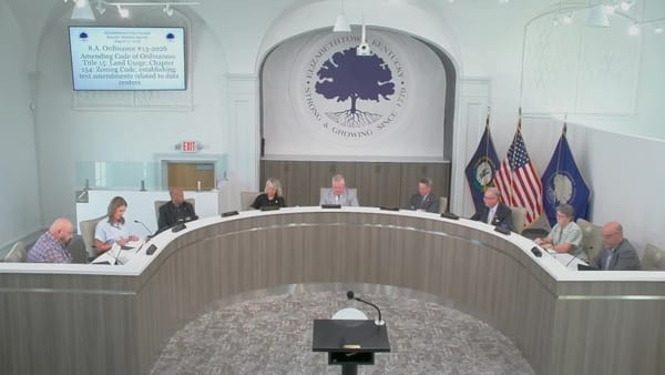 The Elizabethtown City Council at the dais during the second reading of data center Ordinance 13-2026, with the agenda item displayed on screen, August 17, 2026